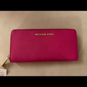 Micheal Kors jet set travel raspberry wallet
